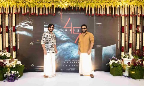 (l-r) RJ Balaji; Suriya (X)