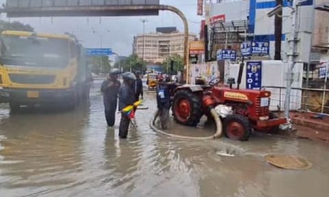 GCC workers clearing stagnant water at GP Road.