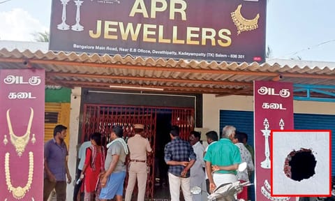 The jewel shop looted by burglars. (Right) Hole drilled to gain access