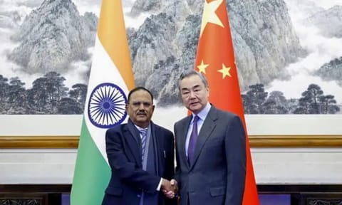 National Security Advisor Ajit Doval with Chinese Foreign Minister Wang Yi and other dignitaries during a meeting, in Beijing, China. (PTI Photo)
