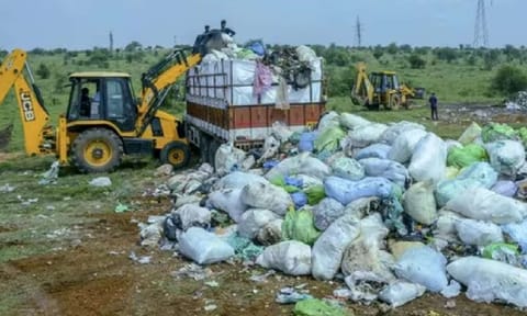 Medical and other waste from Kerala that was illegally dumped in Tirunelveli is being removed by Kerala authorities, in Tirunelveli, Tamil Nadu, on Sunday (PTI)&nbsp;