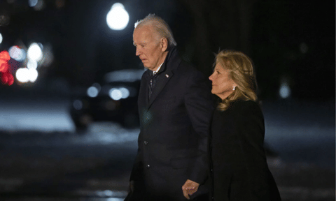 President Joe Biden and first lady Jill Biden walk from Marine One as they arrive back at the South Lawn of the White House (AP)