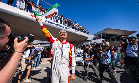Ajith Kumar waving the Indian flag after race win&nbsp;