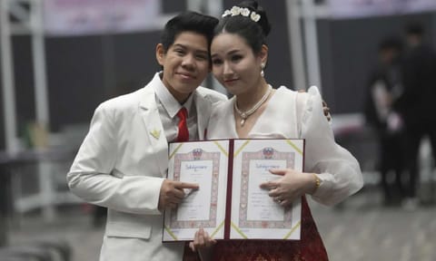 Kwanporn Kongpetch and Ploynaplus Chirasukon from the LGBTQ+ community show their marriage certificates after the Marriage Equality Act took effect Thailand (AP)Share