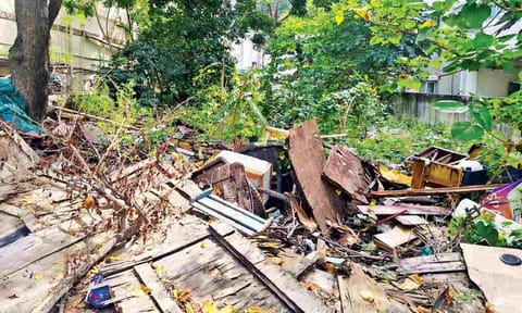 Solid waste and damaged furniture materials dumped on vacant land along Madha Church Road in Mylapore&nbsp;