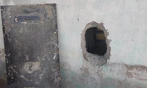 Damaged wall at TASMAC shop following burglary attempt