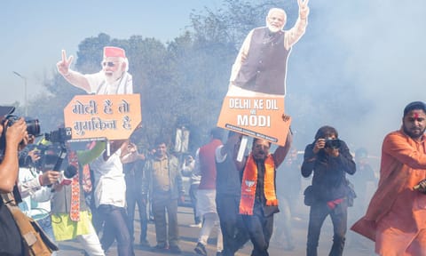&nbsp;BJP supporters celebrate the party's decisive lead in the Delhi Assembly polls as counting of votes is underway, at BJP office in New Delhi (PTI)