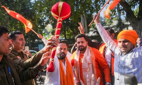 BJP workers celebrate outside the residence of Aam Aadmi Party (AAP) chief and candidate from New Delhi constituency Arvind Kejriwal, amid the counting of votes for Delhi Assembly elections, in New Delhi (PTI)&nbsp;