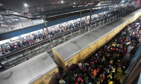 Heavy rush of passengers to catch a train for Mahakumbh, at the New Delhi railway station (PTI)