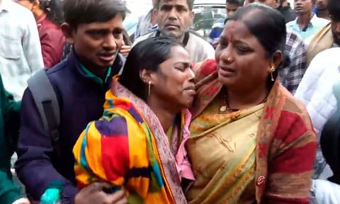 Relatives of victims wait outside the mortuary at the LNJP Hospital (PTI)