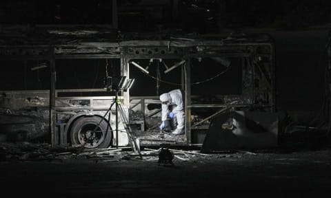 A Israel police officer inspects the scene (AP)&nbsp;