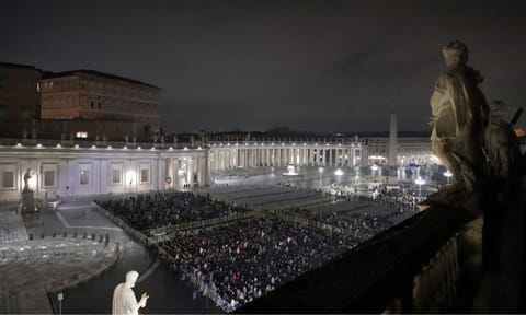 People attend a rosary prayer service held for the health of Pope Francis in St Peter's Square at The Vatican (AP)