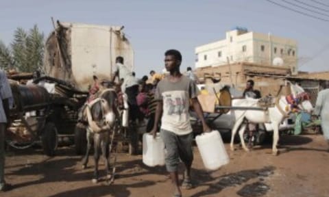 People gather to collect water in Khartoum, Sudan (AP)&nbsp;
