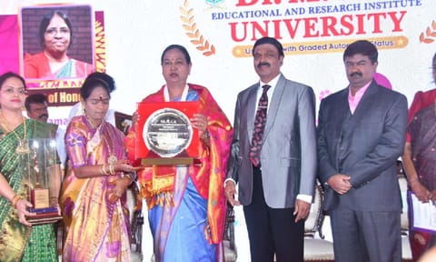 DMDK general secretary Premalatha Vijayakant receiving lifetime achievement award from Dr MGR University on Saturday