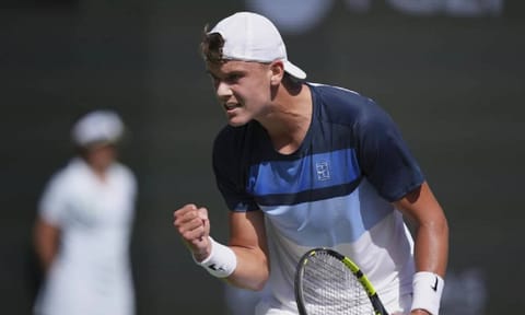 Holger Rune, of Denmark, celebrates a point against Daniil Medvedev, of Russia, during their semifinals match at the BNP Paribas Open tennis tournament Saturday (AP)
