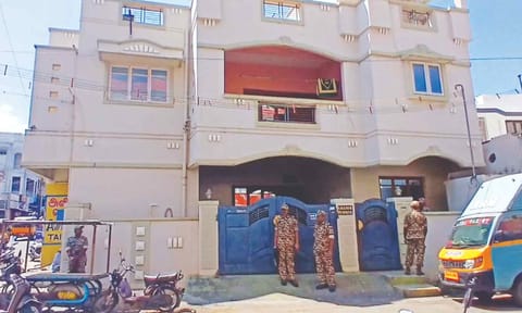 CRPF personnel standing guard as ED officials conduct raid at the house of Razik in Coimbatore on Thursday