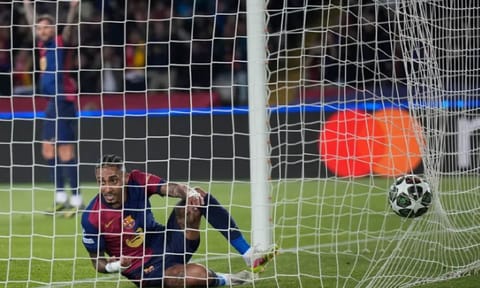 Barcelona’s Raphinha scores his side’s opening goal during the Champions League quarterfinal first leg soccer match between Barcelona and Borussia Dortmund (AP)
