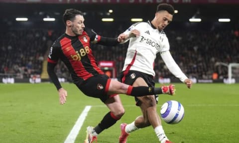 Fulham's Adama Traore, left, and Bournemouth's Dango Ouattara battle for the ball during English Premiere League Soccer match (AP)