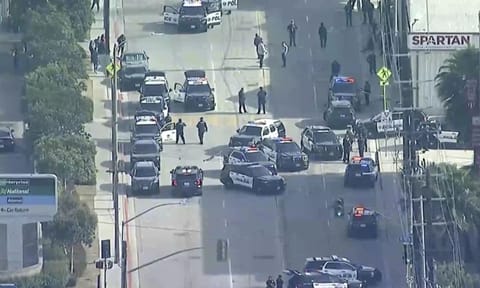Law enforcement gathers outside Spartan College of Aeronautics and Technology, Inglewood (AP)