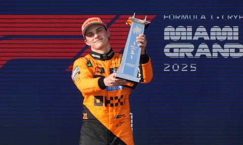 McLaren driver Oscar Piastri celebrates on the podium after winning the Formula One Miami GP