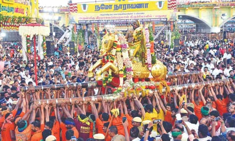 Lord Kallazhagar arriving at Vaigai river amidst massive crowd of devotees on Monday&nbsp;