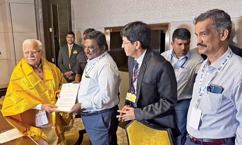 Minister SS Sivasankar handing over a memorandum to Union Electricity Minister Manohar Lal in Bengaluru on Friday