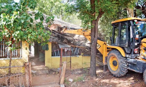 House constructed on the temple land being razed down in Thanjavur on Wednesday
