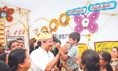 School Education Minister Anbil Mahesh Poyyamozhi with students at an Ennum Ezhuthum centre (file photo)