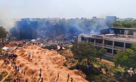 &nbsp;People gather at the site after an Air India plane crashed moments after taking off from the airport, in Ahmedabad (PTI)&nbsp;
&nbsp;