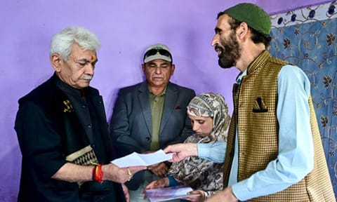 J&amp;K LG Manoj Sinha hands job letter to his wife Gulnaz Akhter (Photo/X/@OfficeOfLGJandK)&nbsp;
