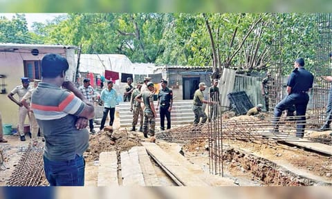 Army personal demolishing the partially built temple on Thursday
