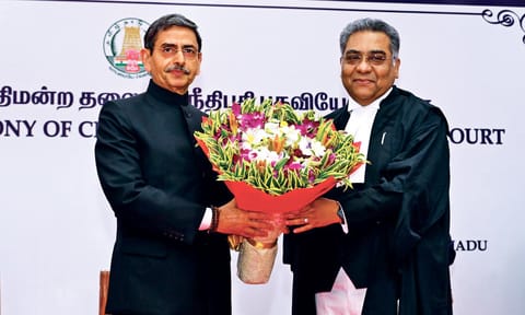 Governor RN Ravi presents a bouquet to newly sworn Chief Justice, MM Shrivastava, at Raj Bhavan, on Monday
