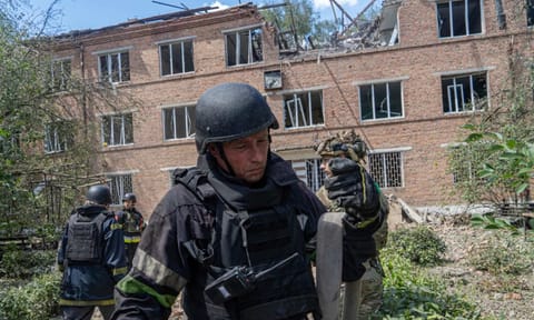 Rescuers work at a damaged city hospital that was hit by a Russian guided air bomb in Kharkiv, Ukraine (AP)&nbsp;