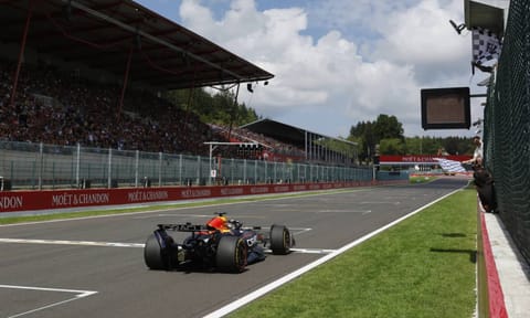 The checkered flag goes out as Red Bull driver Max Verstappen of the Netherlands crosses the finish line to take first place during the sprint race ahead of the Formula One Grand Prix at the Spa-Francorchamps racetrack in Spa, Belgium, Saturday, July 26, 2025 (AP)&nbsp;