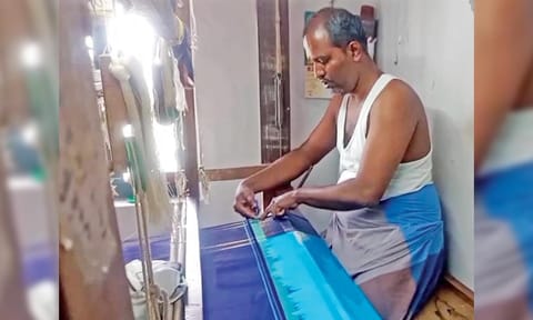 A focussed Rajasekar engaged in weaving the award-winning korvai saree