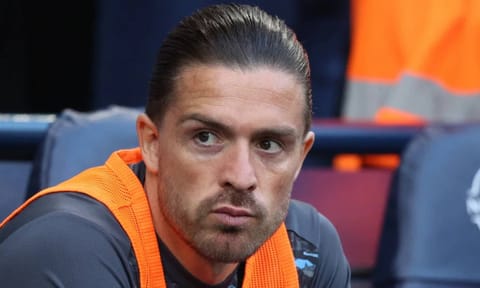 Jack Grealish on the bench during a match last season&nbsp;