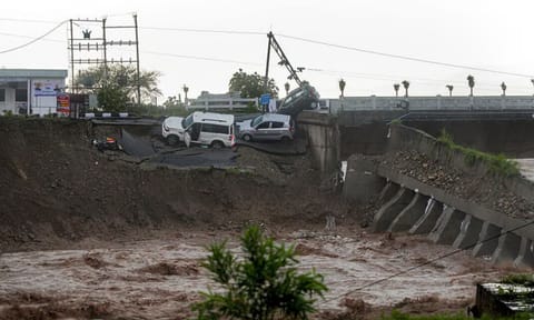 Vehicles stuck as a portion of the Fourth Tawi Bridge damaged (PTI)