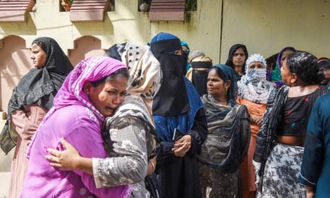 Family members of the 12-year-old girl who died on Wednesday, mourn, after she was found with severe burn injuries inside the washroom of a government-run school, in Patna, Thursday, Aug. 28, 2025 (PTI)&nbsp;