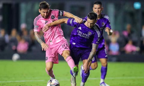 Lionel Messi dribbles past David Brekalo in the match&nbsp;