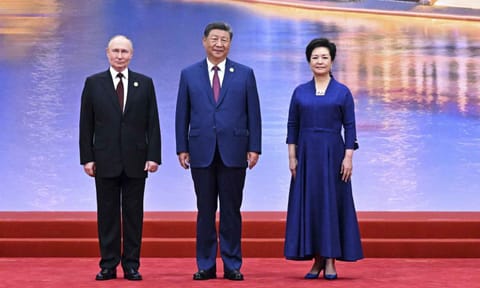 Russian President Vladimir Putin, left, Chinese President Xi Jinping, center, and his wife Peng Liyuan pose for a photo at a ceremony to welcome Heads of States of the Shanghai Cooperation Organization (SCO) summit in Tianjin, China , on Sunday, Aug. 31, 2025 (AP)&nbsp;