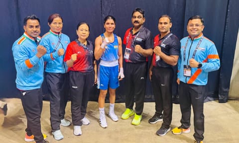 Nikhat Zareen with her coaches after her win