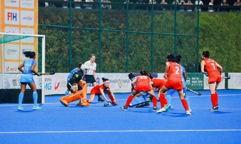Korean players defend a Indian penalty corner