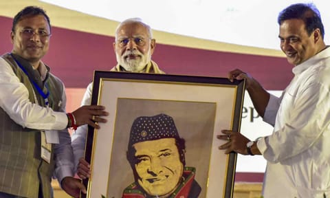 Prime Minister Narendra Modi being felicitated with a portrait of legendary singer and Bharat Ratna awardee Bhupen Hazarika by Assam Chief Minister Himanta Biswa Sarma and others during a programme organised on the occasion of the singer's birth centenary celebration, in Guwahati, Assam (PTI)&nbsp;