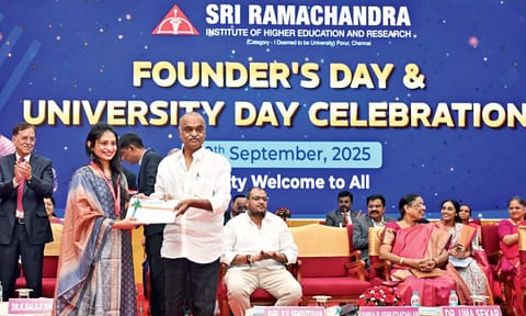 Chancellor VR Venkataachalam presenting Dr V Sanjana with three gold medals for her academic performance