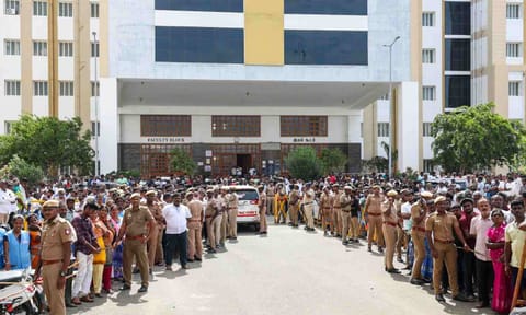 Police personnel and others at the Government Hospital, where injured persons of a stampede that occurred at actor and TVK chief Vijay's rally on Saturday, in Karur district, Tamil Nadu, Sunday, Sept. 28, 2025 (PTI)&nbsp;