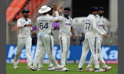 India's Mohammed Siraj, center, celebrates with teammates after the dismissal of West Indies' Tagenarine Chanderpaul on the first day of the first Test cricket match between India and West Indies at Narendra Modi Stadium in Ahmedabad (PTI)&nbsp;