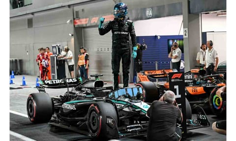 &nbsp;George Russell stands on his car as he celebrates getting pole position&nbsp;
&nbsp;