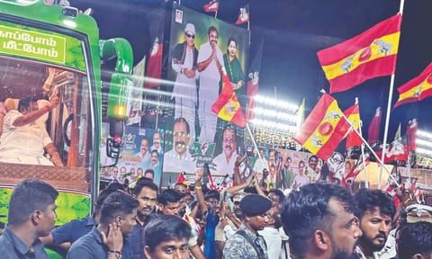 TVK flags mark their strong presence as AIADMK general secretary Edappadi Palaniswami waves at supporters in Namakkal