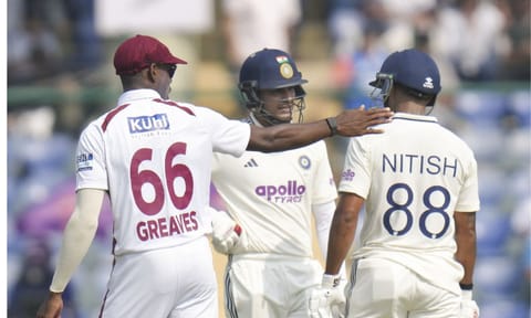India's captain Shubman Gill, center, and Nitish Kumar Reddy, right, on day two of the second and final Test cricket match of a series between India and West Indies, at the Arun Jaitley Stadium, in New Delhi, Saturday, Oct. 11, 2025. West Indies' Justin Greaves is also seen.&nbsp; (PTI Photo/Shahbaz Khan)