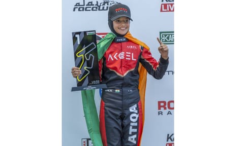Indian racer Atiqa Mir, 10, celebrates victory in round one of RMC Invitational Karting Series, at Al Ain Raceway, in United Arab Emirates, Sunday, Oct. 12, 2025 (PTI)&nbsp;